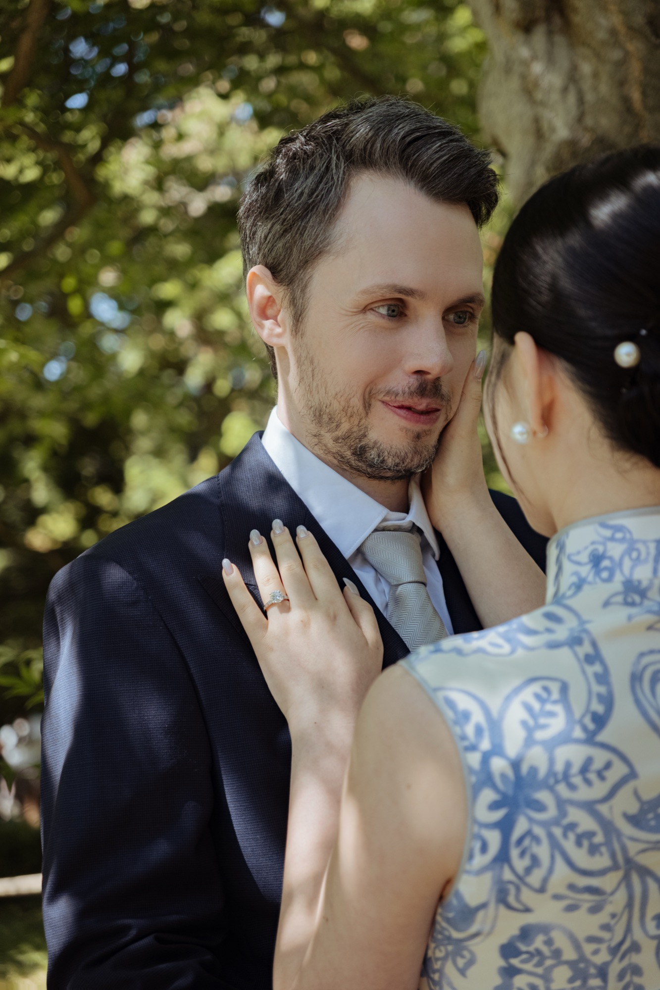 A close portrait of the couple in the Japanese Tea Garden