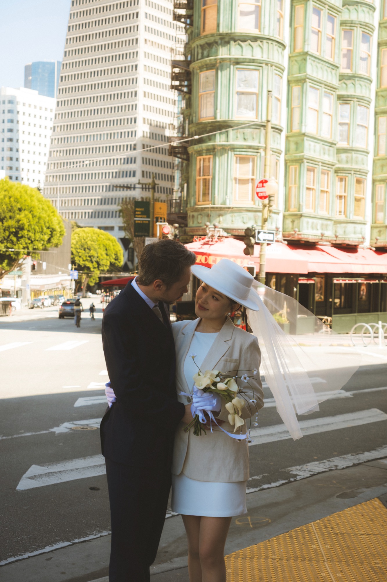 The newlyweds crossing a San Francisco street