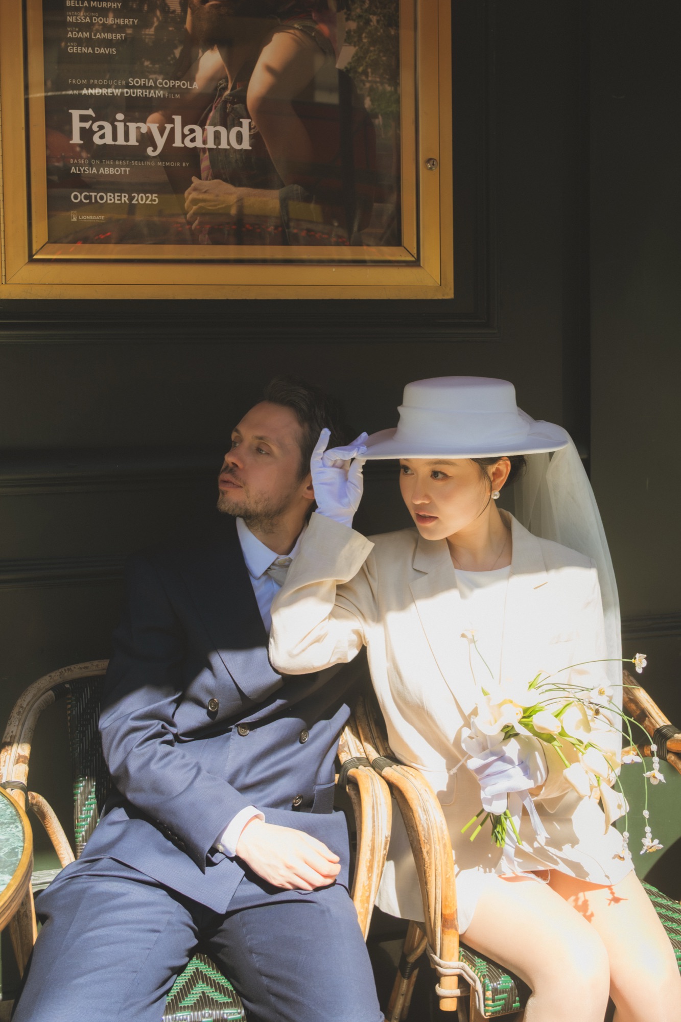 The newlyweds seated together in warm afternoon light