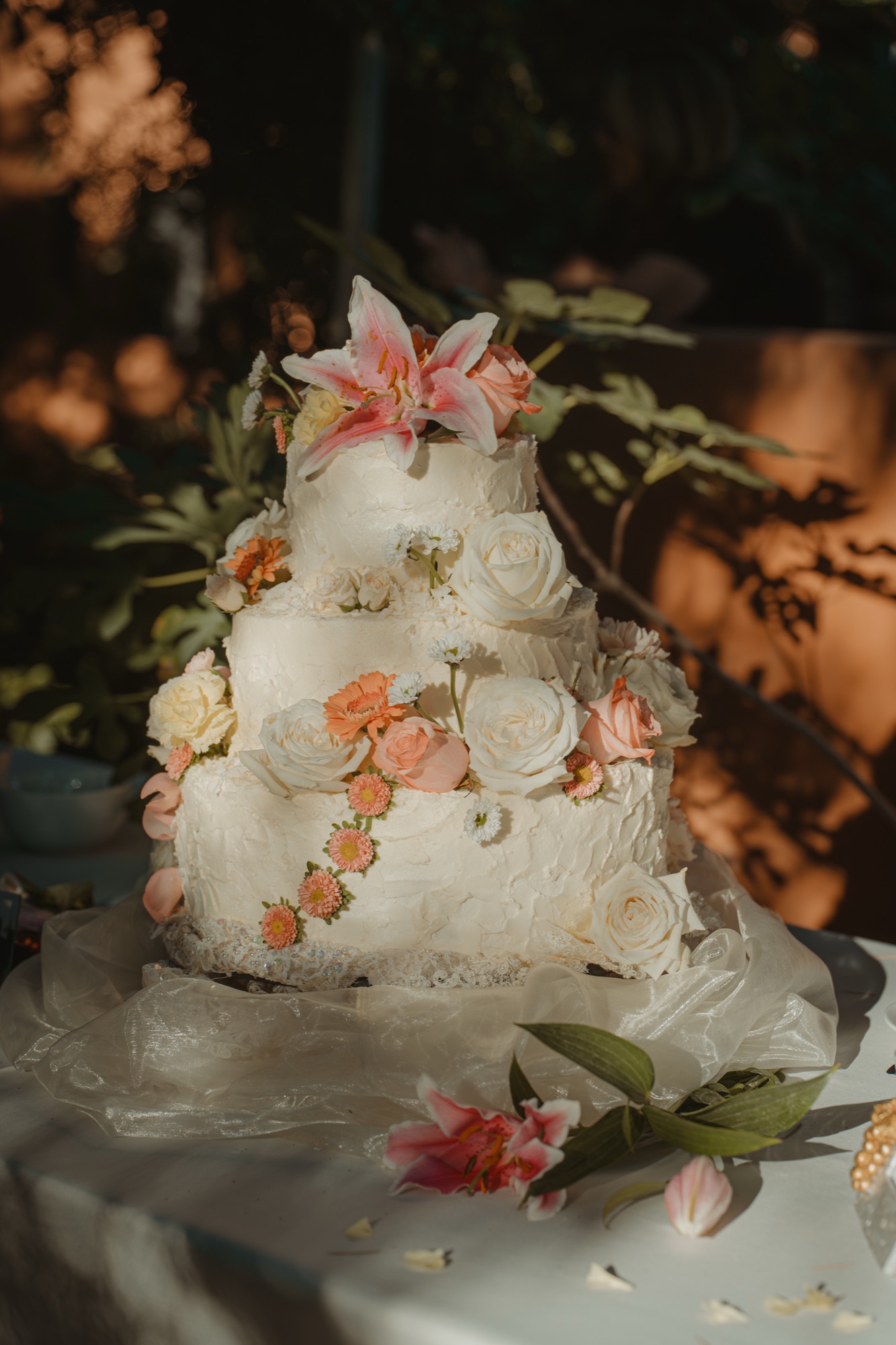 A close view of the flower-covered wedding cake
